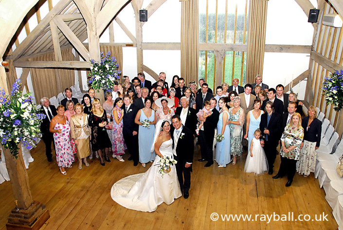 Wedding congregation shot from balcony at Betchworth near Reigate at the foot of the North Downs in Surrey.